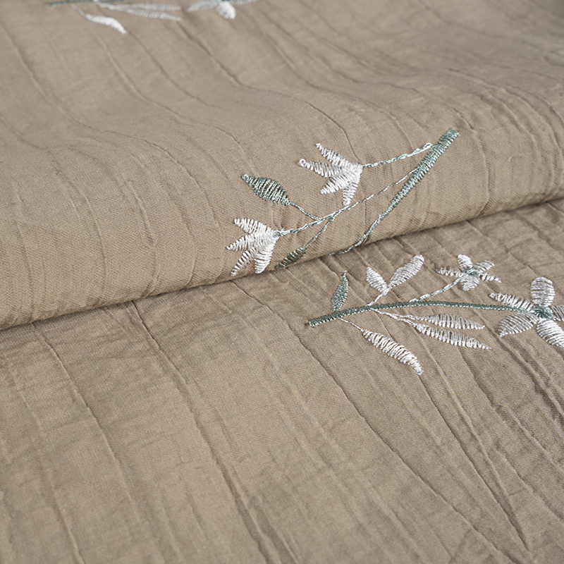 Vrásčitá látka na vyšívání květů se semínky broskvové orchideje